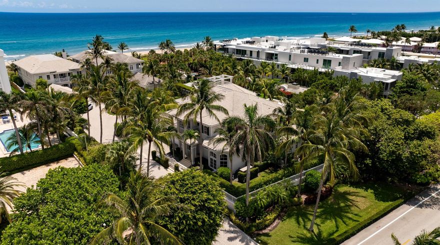 This Delray Beach residence, in a private, oceanside, three-estate gated community, offers deeded beach access via its own private beach path. Conveying as an architectural triumph, it features a unique third-story ocean-viewing observation tower, an expansive covered balcony with several interior access points, chiseled marble floors, decorative ceilings, and alluring bay-windowed sitting areas.