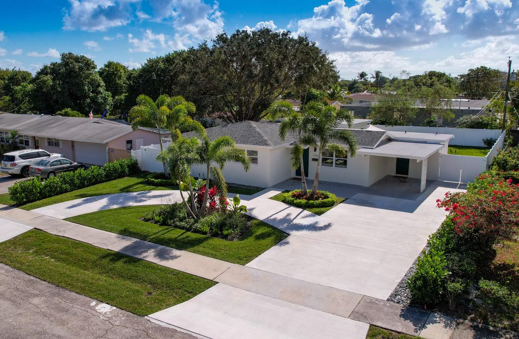 Photo of 728 W Kalmia Drive, Lake Park, FL 33403 (MLS # R10777660)