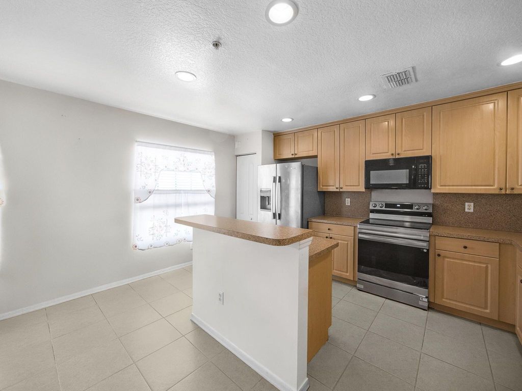 Photo of 1898 SE Interlachen Drive, Port Saint Lucie, FL 34952 (MLS # R11090916)