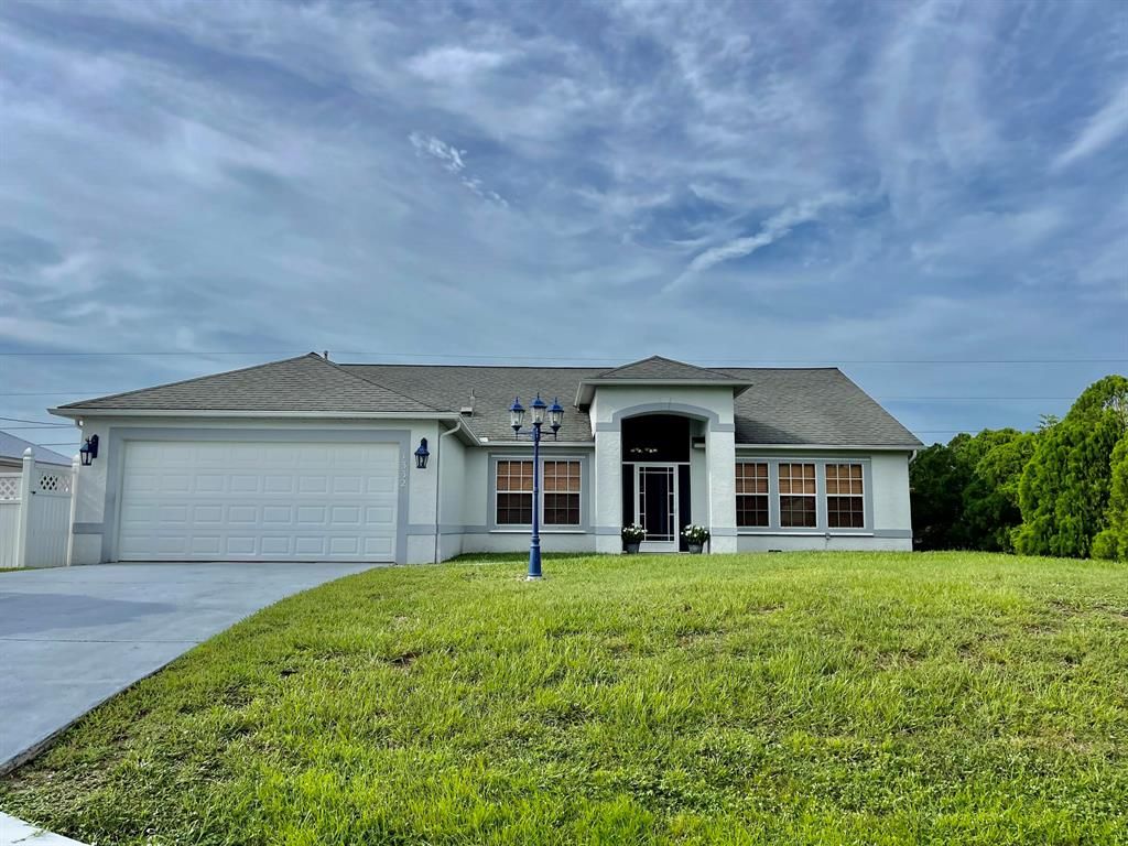 Photo of 1332 SW Calmar Avenue, Port Saint Lucie, FL 34953 (MLS # R11007719)