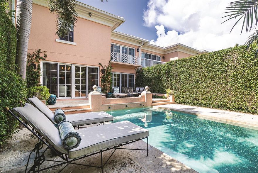 One of a kind townhouse. Fully renovated with gourmet kitchen, double bath suites in Master, all new impact glass throughout. Professionally designed by Hive Interiors. Exquisite attention to detail. Landscape redesigned by Nievera Williams. Private pool, elevator and 2 car garage. This property has it all! Fabulous in town location.