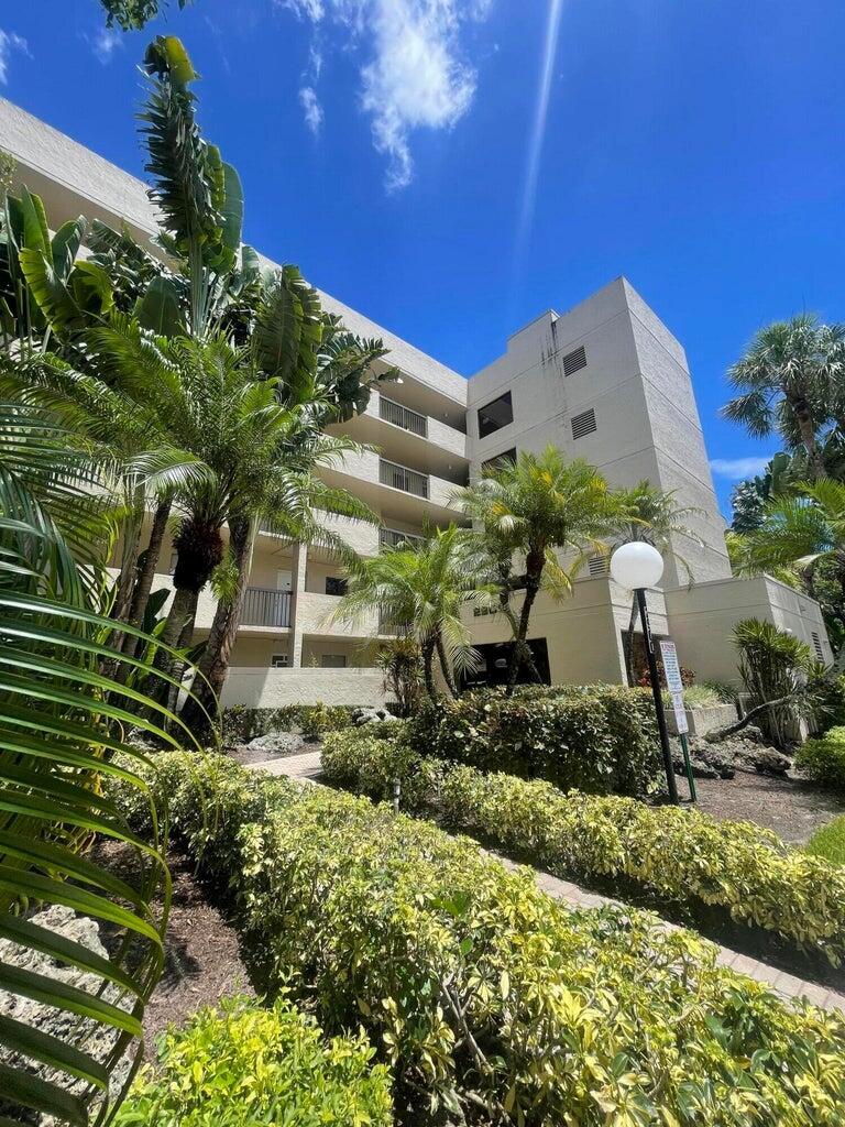 FANTASTIC LOCATION!Don't miss this top-floor, light-filled unit in the highly sought-after Tradewinds community, offering peaceful lake and preserve views. This immaculate condo features an updated kitchen with granite countertops, stainless steel appliances, and a brand-new refrigerator. Both bathrooms have been tastefully upgraded, and the custom built-in closets maximize storage. You'll love the tile flooring throughout, in-unit washer/dryer, newer A/C, and secure lobby entrance.Just steps from the community pool and minutes to The Promenade for shopping, dining, movies, and entertainment. Enjoy resort-style amenities including two pools, fitness center, theatre, tennis courts, basketball, and more!Association requires a minimum 650 credit score. Schedule your private showing