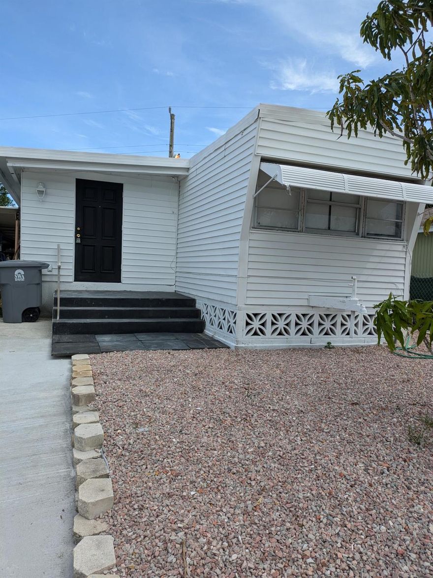Completely remodeled with new kitchen, new bathrooms, new flooring. New central a/c . LED lighting. Driveway fits up to 3 cars.