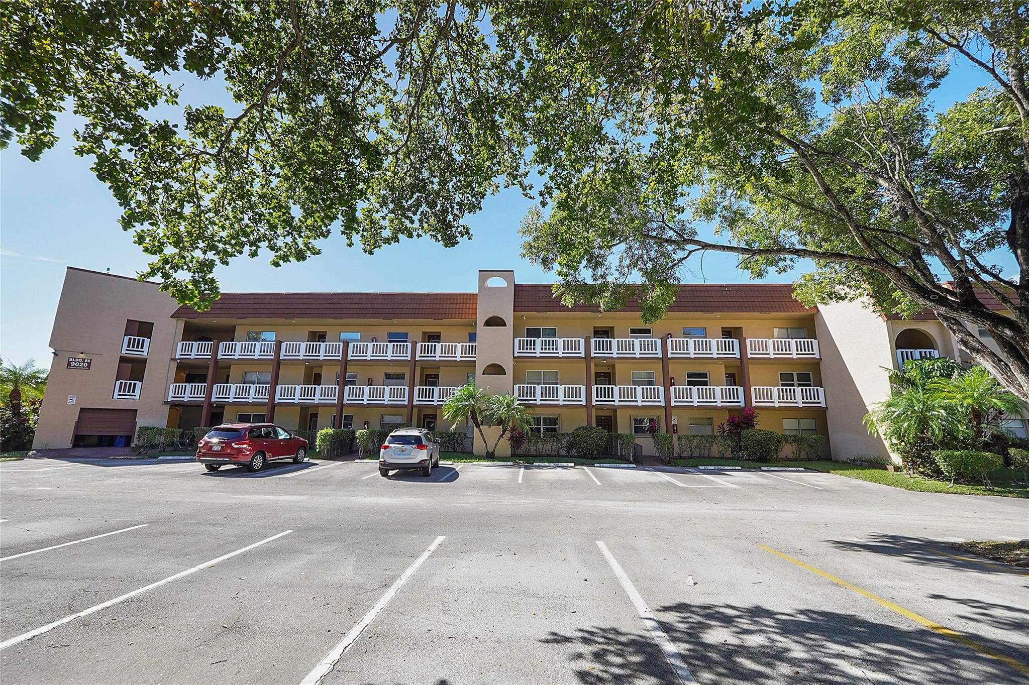 This spacious 1,100+ sq ft top-floor furnished corner unit offers breathtaking golf and water views, located in a resort-style 55+ community packed with amazing amenities. Enjoy activities like golf, billiards, indoor and outdoor pools, sauna, jacuzzi, bingo night, a theater, tennis, pickleball, and a BBQ area, plus convenient bus service. The open kitchen features stainless steel appliances, and the updated bathrooms add modern comfort. Relax in the enclosed Florida room with unbeatable views, and make use of the Murphy bed in the guest bedroom for extra convenience. This is the perfect spot to enjoy both relaxation and an active lifestyle!