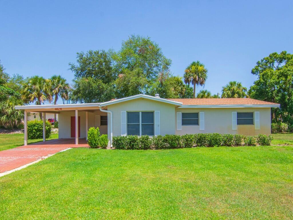 This captivating home is a must see! Join the community at this fully manicured huge lot + home with an extended driveway, huge covered porch and fenced in backyard all backing up to a polished park and stones throw from local school. Enter the home to reveal a well arranged floor plan with tile floors that has spacious living room, remodled kitchen, dining and closed in patio all under air. 3 spacious bedrooms 2 baths with new vanities, new roof 2025, newer a.c, updated electrical, repiped, new water heater, new window treatments, fresh paint all cleaned and vacant. 10 mins to the beach!