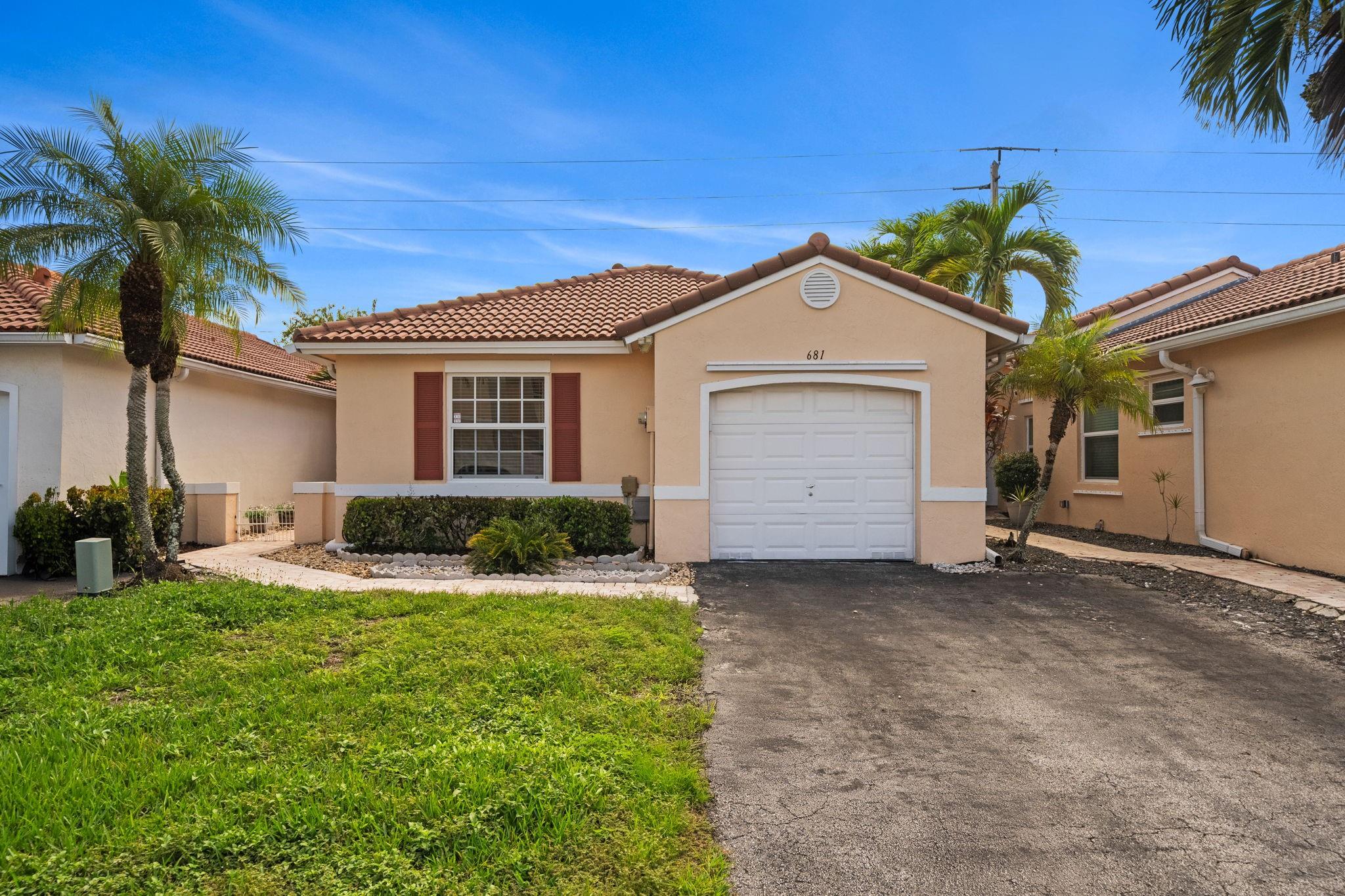 Welcome to this charming 2-bedroom, 2-bathroom Home nestled in the highly sought-after Mitsy Bay at Silver Lakes neighborhood. This home offers a perfect blend of comfort and convenience. Step inside to find a beautiful tile flooring throughout and an updated kitchen featuring stainless steel appliances. The home is also equipped with hurricane impact windows for your peace of mind. Fully fenced yard with a paver patio, perfect for relaxing or entertaining guests. The garage is also completely tiled, making it a versatile space. Located in West Pembroke Pines, this home is a stone's throw away from A+ rated schools and a variety of community amenities, including pools, playgrounds, pavilions, sports courts, and a boat ramp. You'll also be within walking distance of local malls.