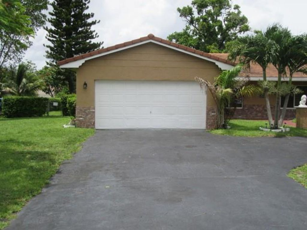 Photo of 4100 NW 110th Ave, Coral Springs, FL 33065 (MLS # F10517665)