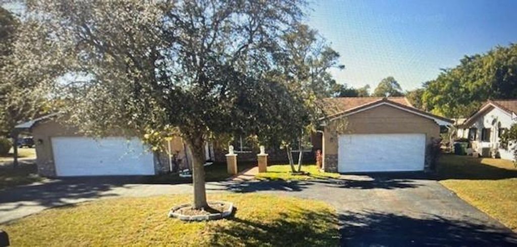 Photo of 4100 NW 110th Ave, Coral Springs, FL 33065 (MLS # F10517665)