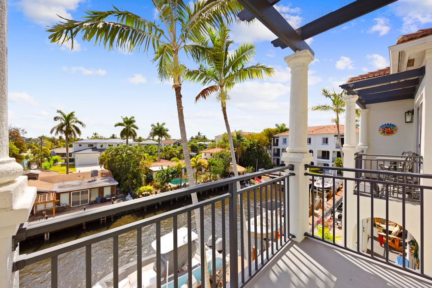 Experience the ultimate boater's dream and the very best of South Florida waterfront living in this fully redesigned Intracoastal townhome. Perfectly positioned with a 30 foot deeded private dock just steps from your back patio, this residence offers direct boating access with close proximity to the Boynton Inlet, allowing you to reach the open ocean within minutes. Enjoy effortless days on the water, waterfront dining by boat, and quick access to downtown Delray Beach and world famous Atlantic Avenue, known for its award winning restaurants, boutique shopping, vibrant nightlife, and pristine beaches. This is true South Florida luxury lifestyle living, both walkable and boatable.  Fully renovated from top to bottom, this 4 bedroom, 3.5 bath residence showcases exceptional craftsmanship a modern design throughout. Impact windows and doors provide security and peace of mind while framing stunning water views. Oversized 100 x 40 Lava Grey porcelain tile floors create a sleek architectural foundation across the main living areas. The fully customized chef's kitchen imported from Italy features custom Italian cabinetry, quartz countertops, premium Bosch appliances, and a built in wine fridge, delivering both beauty and performance for everyday living and elevated entertaining.  Every bathroom has been completely redesigned with custom finishes and spa inspired detailing, offering a refined and cohesive aesthetic throughout the home. From soaring ceilings and seamless indoor outdoor flow to designer materials and meticulous upgrades, every element has been thoughtfully curated.  Move in ready, boat ready, and lifestyle ready, this is Intracoastal living without compromise.