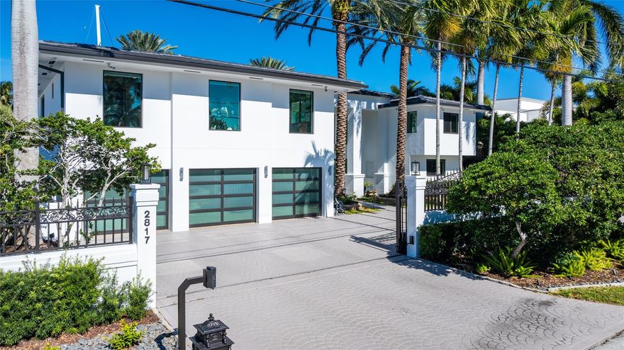 This is the Coral Ridge deep water estate that you have been searching for!  This home has been completely remodeled with high impact glass, new flooring, new roof, high-end appliances, stucco, paint, and 12K pound lift on the dock.  All of the systems in the home have been updated within the last 2 years including: full home generator, all A/Cs, pool equip., and tank-less gas water heaters.  When you enter through the privacy gates you will find a modern home with almost 6,000 sq ft of air conditioned living space.  Step outside to an oasis that includes a spectacular custom pool with spa and infinity edge, cbs construction pavilion that houses the summer kitchen and bar area for dining, and a concrete dock all surrounded and covered with gorgeous marble and landscaping!