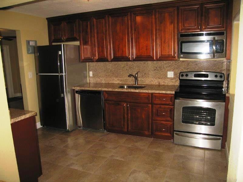 Please excuse the photos. Tenant has been renting for 10 years. The interior and exterior are scheduled to be painted. The interior will be a contemporary off-white color. This beautiful home features stainless appliances, granite countertops, ceramic tile floors, a separate family room, Central A/C, dishwasher, washer and dryer and a sparkling pool. The property sits on a huge 12,000 sq. ft. fenced lot. Perfect for living and entertaining. It is conveniently located close to I-95 and a short drive to the beach.