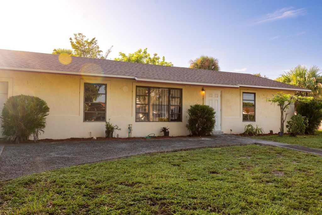 Photo of 1484 N Mangonia Drive, West Palm Beach, FL 33401 (MLS # R11012577)