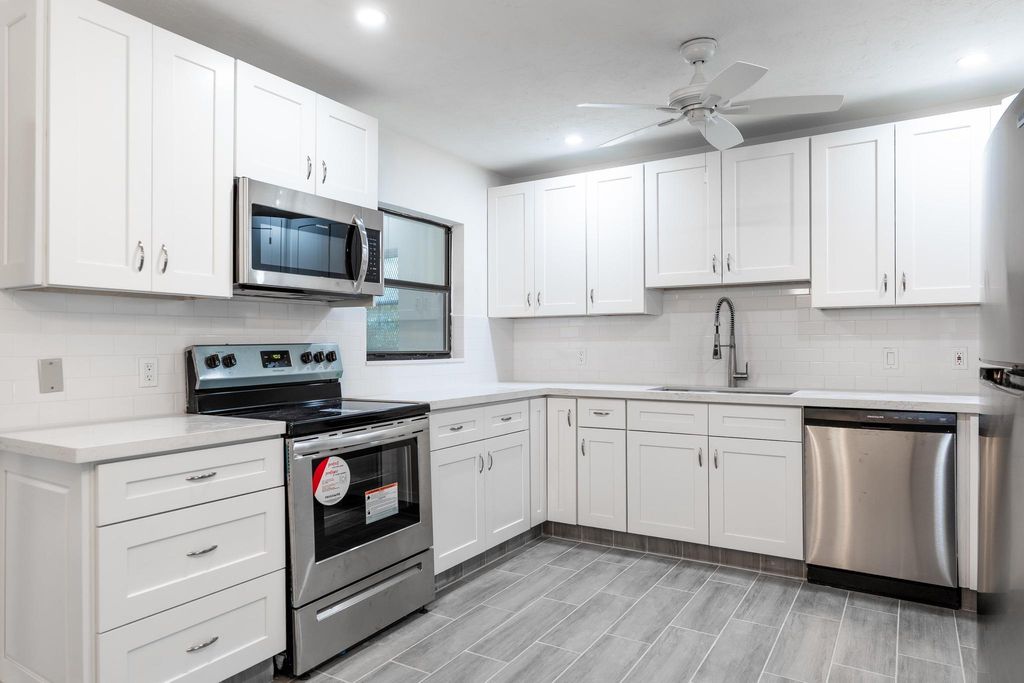 Photo of 1484 N Mangonia Drive, West Palm Beach, FL 33401 (MLS # R11012577)