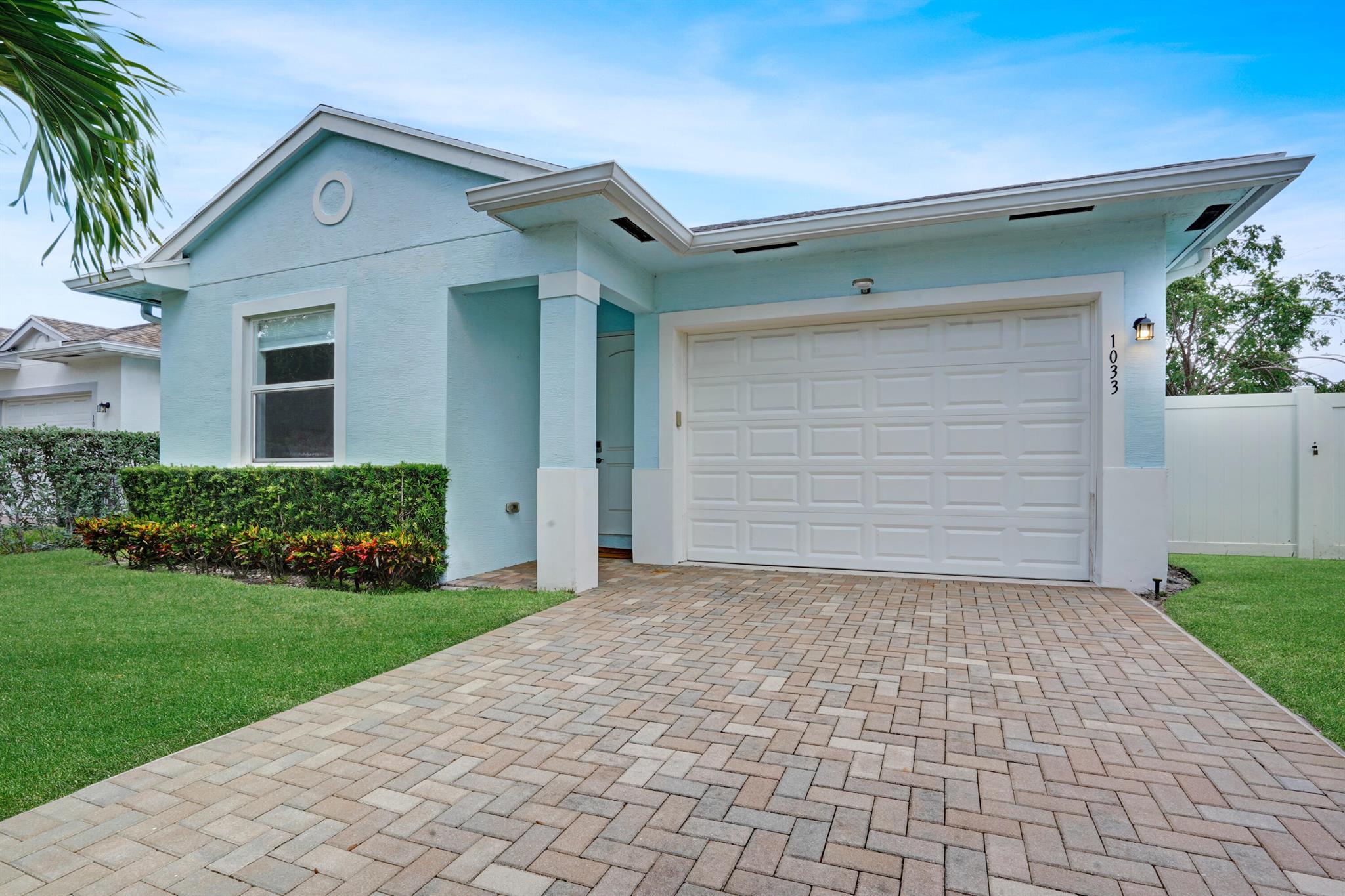 Welcome to 1033 Mango Drive, a charming 3-bedroom, 2-bath single-family home ideally located just minutes from Delray Beach's vibrant downtown scene--full of boutique shops, acclaimed restaurants, and the lively coastal atmosphere this area is known for. Built in 2020, this newer construction home sits on a desirable corner lot and is fully fenced for added privacy. Inside, you'll find an inviting open floor plan with a spacious kitchen, perfect for entertaining. The primary suite features his and her walk-in closets, while impact windows and doors provide peace of mind and energy efficiency. With no HOA and no restrictions, this property offers endless possibilities--ideal for first-time homebuyers or investors looking to expand their Airbnb portfolio.Move-in ready and low maintenance