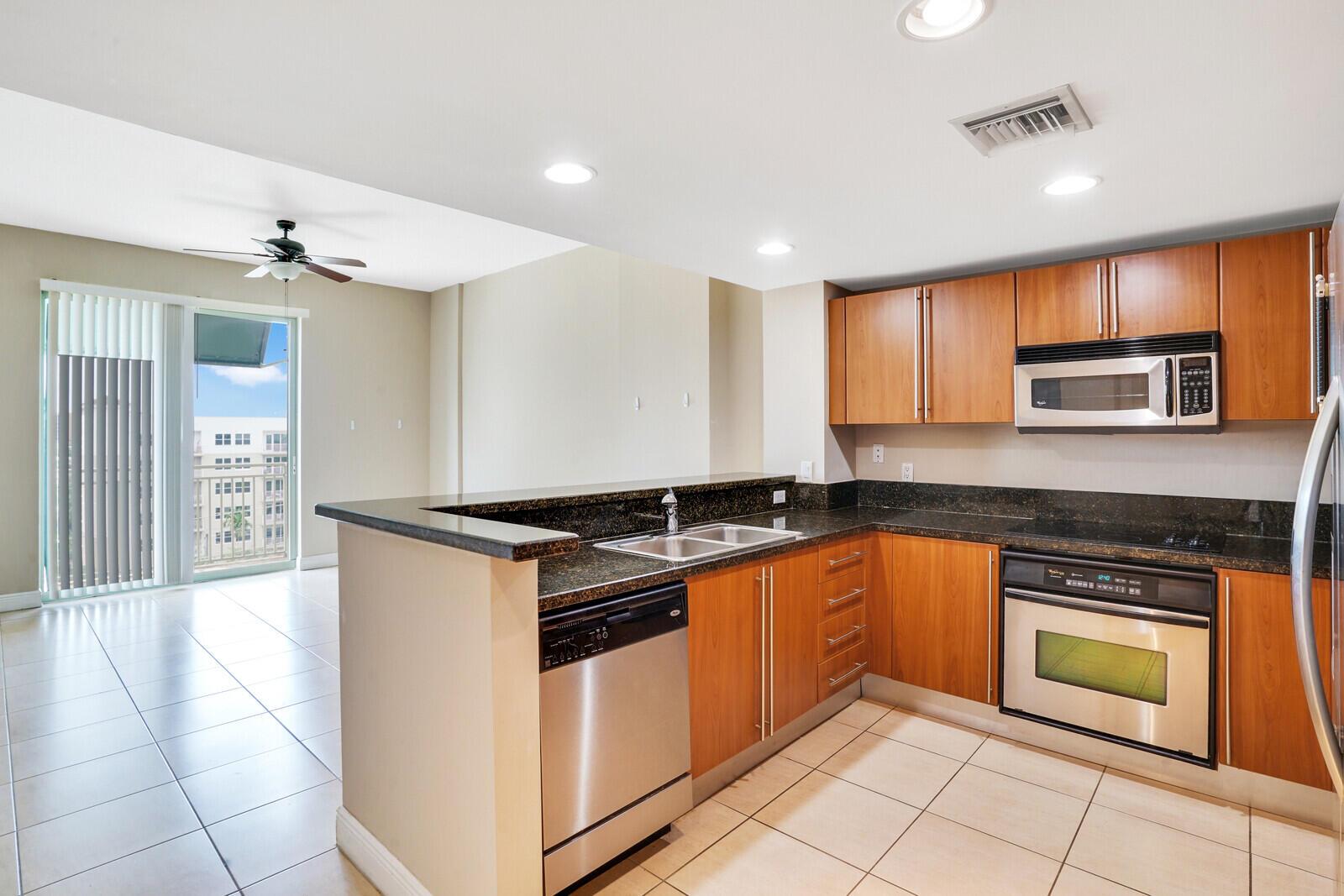 ''Experience luxury living at 610 Clematis, a stylish one-bedroom condo overlooking Rosemary Square. This spacious unit features Italian cabinetry, ceramic tile in the living area, and carpet flooring in the bedroom,. Enjoy stunning city lights and a glimpse of the Intracoastal Waterway and Clear Lake from your private space. Residents enjoy 24/7 security with professional controlled access and closed-circuit cameras.Amenities include a state-of-the-art fitness center with cardio equipment, free weights, dry sauna, and steam room. The ultra-chic lobby boasts limestone and coffered ceilings, setting the tone for a contemporary lifestyle. The 3,400 sq. ft. recreation deck features a lush courtyard, two BBQ areas, water fountain, and Zen garden. Relax in the