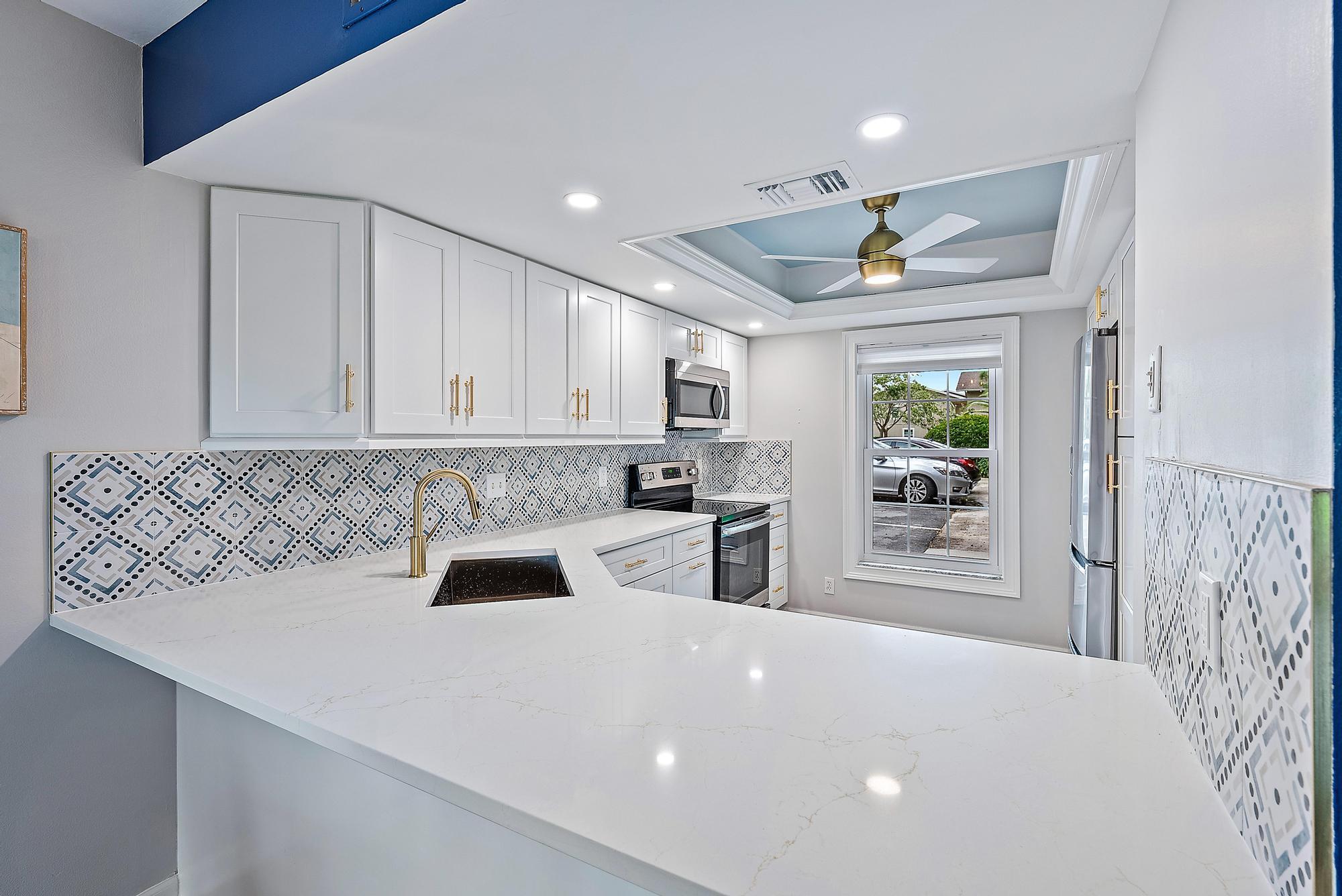 Looking for the perfect 6 month furnished rental in Jupiter? YOU FOUND IT! Welcome to 9170 SE Riverfront Terrace Unit H in Jupiter, FL! This STUNNING and just REMODELED two-story 2-bedroom, 2.5-bathroom condo has over 1,200 square feet and is situated in the prestigious Riverbend Country Club. Boasting IMPACT sliders, stainless steel appliances and breathtaking views of the Loxahatchee River. As you step inside, you'll be immediately struck by the spaciousness and overload of natural light! Continue into your new home, you have a half bath to your left and to your right you have a GORGEOUS renovated kitchen. The kitchen also features ample storage throughout, and a passthrough window where you can see through to your dining and living areas and out to one of your tw