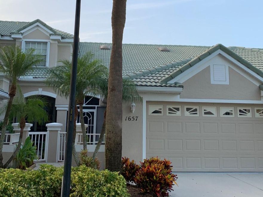 Beautiful lakefront townhome in the highly desirable Lake Charles community of St. Lucie West. This 2-bedroom, 2-bath home with a 2-car garage features stunning lake views, soaring 18' vaulted ceilings, accordion shutters, and a whole-house water filtration system. Enjoy peaceful mornings on the screened porch overlooking the serene lake. Lake Charles offers resort-style amenities, including a clubhouse, pool, hot tub, tennis, pickleball, playground, and scenic walking trails. Non-motorized boating is welcome on the community's pristine lakes. Basic cable is included, and the HOA covers exterior roof maintenance. Conveniently located near shopping, dining, and recreational activities.