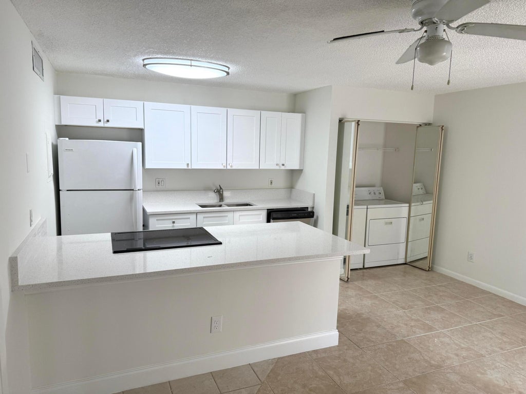 Photo of 629 Executive Center Drive #J103, West Palm Beach, FL 33401 (MLS # B26063906)