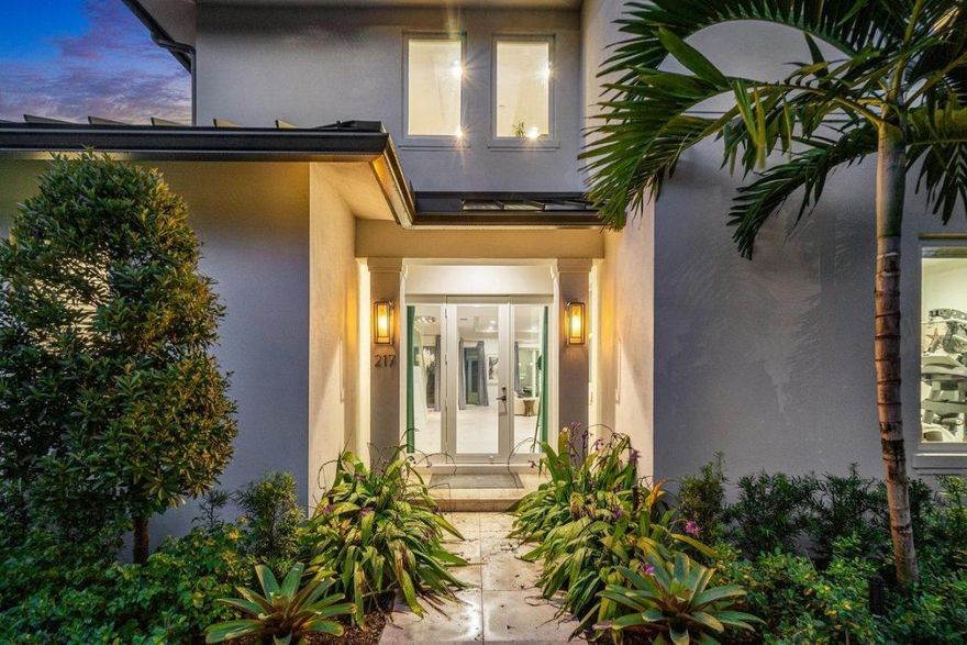 Designed by esteemed architect Randall Stofft, the very best of modern coastal living is showcased in this stunning new construction contemporary residence, ideally located just minutes from the beach and town. Thoughtfully designed as a private coastal compound, the property features a guest house and an impressive 4+ car garage, seamlessly blending open-concept living with abundant natural light, clean architectural lines, and sophisticated modern finishes throughout.

This expansive residence offers six bedrooms and five full bathrooms, complemented by a fully equipped apartment and exceptional indoor-outdoor living spaces. The first floor welcomes you with a striking foyer and flows effortlessly into the chef's kitchen with gas range, dedicated living and dining areas, a serene primary suite, and a full guest suite. Walls of glass sliders open to a covered outdoor living room, lushly landscaped backyard, and an inviting saltwater pool perfect for entertaining or quiet relaxation.

The second level features a generous loft area, three spacious bedrooms, and two full bathrooms, offering flexibility for family living or guest accommodations. Both garages are pre-wired for lifts, cable, and air conditioning, with the second garage opening directly to the pool - ideal as a gym, studio, or versatile flex space. Above the garage, a private apartment with its own entrance includes a full kitchen, large bathroom, laundry, and walk-in closet, perfect for guests or extended stays.

Notable upgrades include designer quartzite countertops, Porcelanosa tile flooring, wood floors, Icynene insulation, Cat-5 wiring, security cameras, alarm system, impact windows and doors, custom closet built-ins, gas water heater, dryer and range, and gas lines for future generator hookup. Located less than 2.5 miles from Delray Beach's renowned Atlantic Avenue, pristine beaches, parks, shopping, and dining, this exceptional coastal modern residence delivers an unparalleled lifestyle in a premier location.

The information published and provided including but not limited to prices, measurements, square footages, lot sizes, features, finishes, and calculations are subject to errors, omissions or changes without notice.  All such information should be independently verified.  All parties should perform their own due diligence to verify all information.