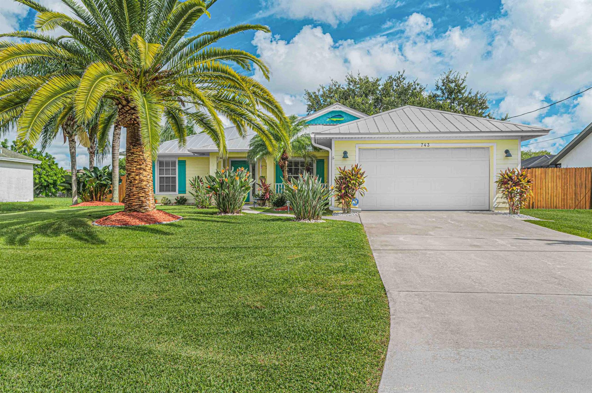 Welcome to this Key West inspired home in the heart of Port St. Lucie. Private yard is completely fenced with a large screened patio. Inside you'll find a split floor plan home. Primary bedroom includes his/her closets, walk-in shower and dual sinks. Open kitchen, living room and dining room for entertaining and den/office. Inside laundry and 2 car garage. This home has been meticulously maintained and ready for you to move right in. Plenty of room for a pool and side yard with room to store boat or RV.