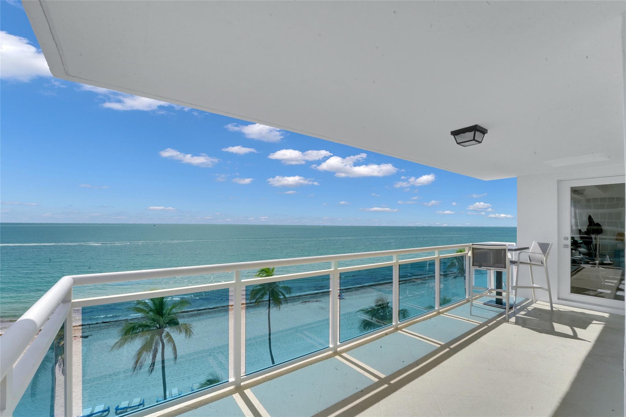 Welcome to the most breathtaking view in the building—this direct oceanfront corner unit is one of the very few 3-bedroom, 3-bath residences in The Commodore, offering an expansive renovated space. Step into a sun-drenched living room with floor-to-ceiling impact windows and a new glass wraparound balcony that brings the Atlantic right to your doorstep. The home features a fully equipped Kosher kitchen, complete with Sub-Zero refrigerator, double ovens, two dishwashers, two sinks, washer/dryer, and premium finishes throughout. Located on the Galt Ocean Mile, The Commodore offers full-service amenities including a heated oceanfront pool, beach chairs, fitness center, community room, 24-hour staffed security, additional storage, and on-site management. Covered parking space that fits 2 cars.