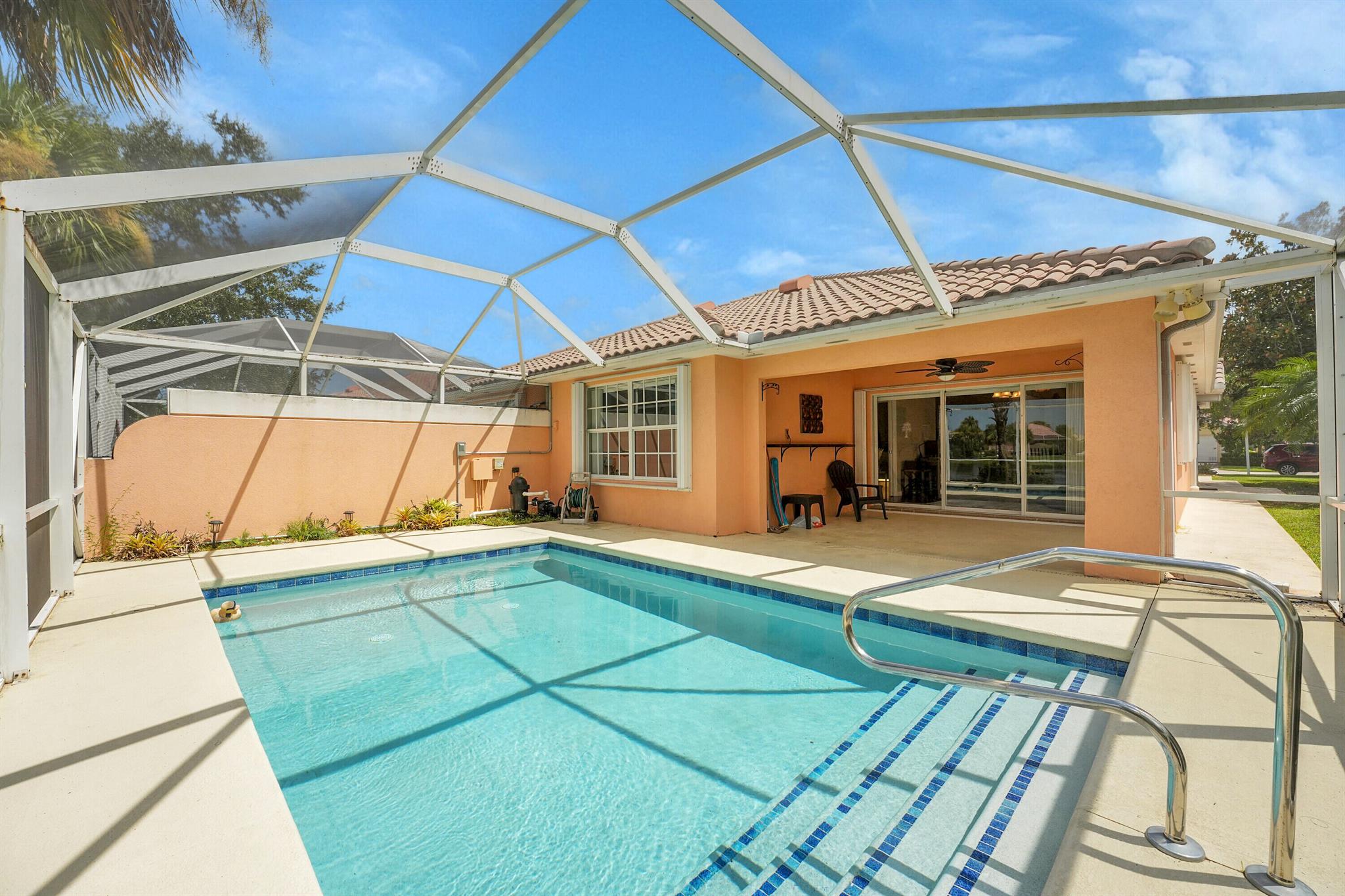 Stunning Waterfront Villa with Private Pool in Lakes at Tradition Enjoy peaceful lakefront living in this charming 2-bedroom, 2-bath villa featuring a private screened pool that's been freshly resurfaced and comes with a newer heater--perfect for sunny days or cool evenings. The open floor plan offers a spacious primary suite, split bedrooms for privacy, and a large laundry room w/ laundry tub for convenience. Set in the gated Lakes at Tradition community, you'll have access to fantastic amenities including a clubhouse, fitness center, two heated pools, tennis and pickleball courts, walking trails, and 24-hour manned security. Located close to shopping, dining, medical centers, and easy highway access, this home blends relaxation with convenience.