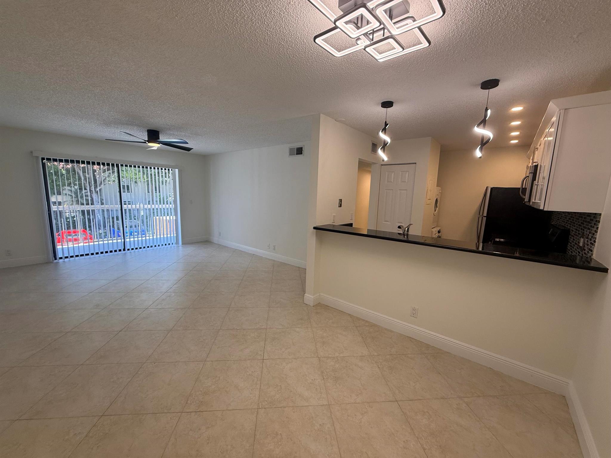 Centrally located and updated 2 BR, 2 BA condo located in Palm Beach Gardens. Open, light and bright floor plan. In unit laundry. The kitchen has beautiful quartz countertops, white shaker cabinentry and newer stainless appliances. The bathrooms are also tastefully upgraded. New fixtures and fans. Covered fenced bike storage & personal storage closet in hall. There is a community pool and tennis courts. Close to Publix, Gym, restaurants, Gardens Hospital, Gardens Mall, 95/Turnpike, and Beaches
