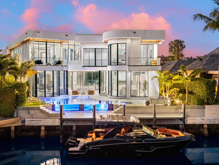 Welcome to Maison de Verre, a contemporary waterfront haven nestled within the prestigious gated community of The Sanctuary in east Boca Raton. This newly constructed estate exudes an air of sophistication, grace, and refined living.

Spanning an impressive 13,993 square feet, with approximately 8,826 square feet of meticulously designed interior space, this contemporary masterpiece boasts 7 bedrooms, 8.2 bathrooms, and 65 feet of waterfront frontage.

Upon arrival, guests are greeted by a grand entrance featuring soaring 30-foot ceilings, while floor-to-ceiling glass windows invite ample natural light to illuminate the expansive interiors. Art aficionados will appreciate the opportunity to showcase their prized collections. The interior design is a harmonious blend of timeless elegance and modern luxury, meticulously curated with impeccable craftsmanship and premium finishes. 

At the heart of the home lies a modern dream kitchen equipped with state-of-the-art appliances, catering to culinary enthusiasts. Every detail is carefully considered, from the sleek glass-enclosed wine display in the dining room to the floating fireplace, adding both warmth and contemporary sophistication to the living space.  Entertaining is effortless in the chic club room, seamlessly transitioning to the outdoor oasis adorned with a covered lanai, lounge area and a well-equipped summer kitchen overlooking the infinity pool and tranquil waterway.


On the second floor, luxury continues to unfold throughout each beautifully curated bedroom suites. The primary suite features panoramic water views, covered terrace, and dual closets and baths. 

The Sanctuary, renowned for its exclusivity and security, provides peace of mind with 24-hour armed roving guards by both land and water. Beyond the unparalleled security, the community offers an array of amenities, including a 23-slip marina, tennis courts, a basketball court, and playgrounds, ensuring enjoyment for both family and guests alike. Nestled in East Boca, residents benefit from proximity to esteemed private schools, the Boca Raton Executive Airport, and numerous recreational and cultural attractions, guaranteeing a lifestyle of unparalleled convenience and sophistication.

Maison de Verre epitomizes luxury and magnificence, offering an unparalleled sanctuary for discerning individuals seeking the epitome of waterfront living.

A membership to The Boca Raton will be included if the property is purchased at the full asking price.