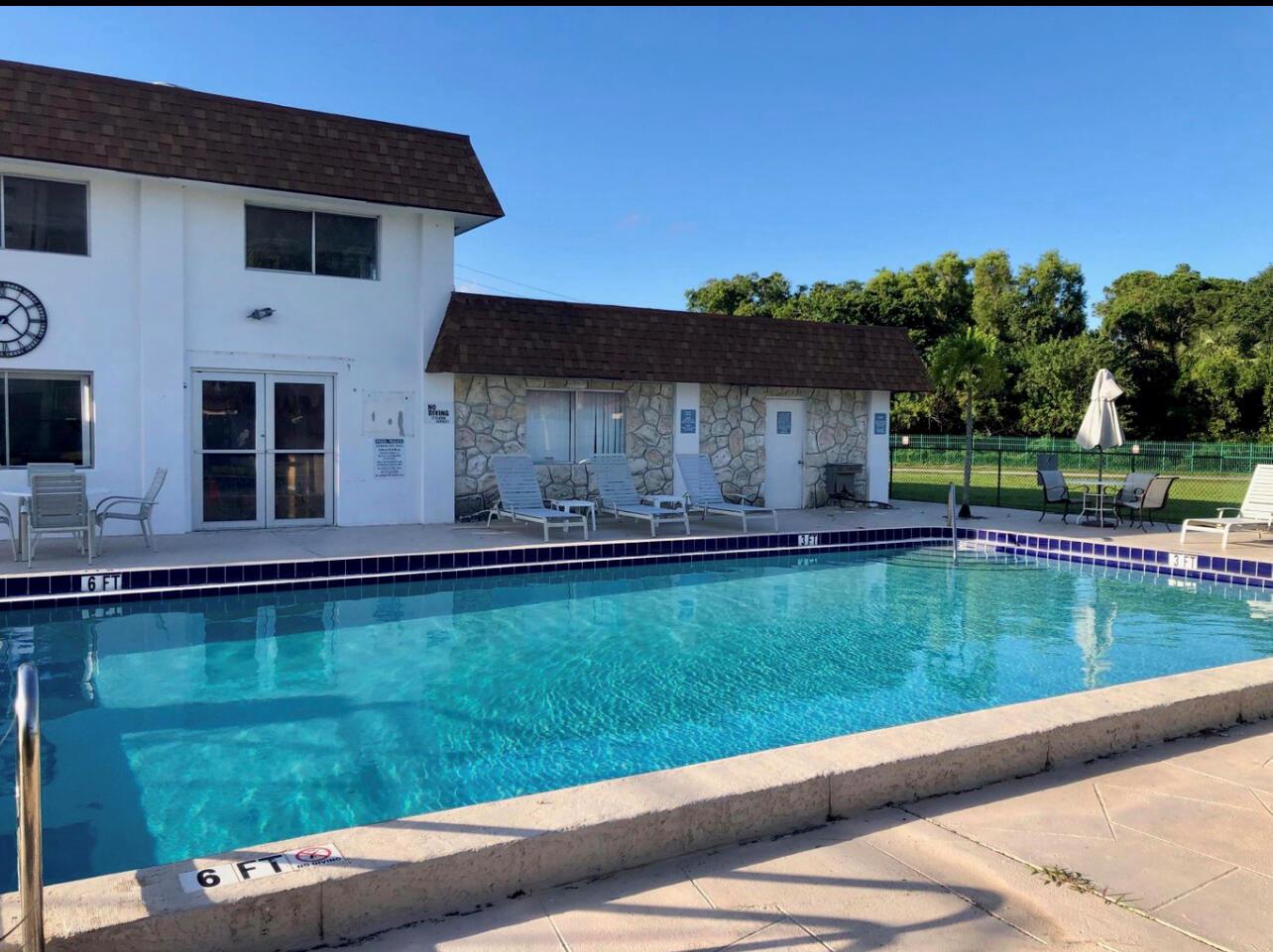 Beautifully Upgraded 1 Bedroom, 1 Bath Condo in Prime Location!Spacious and move-in ready, this condo offers an enclosed balcony with a tranquil water view, plenty of storage space. The location can't be beat as the condo is located close to the center of town, schools and highway access Assigned parking space, elevator access. Enjoy the sparkling community pool. Water is included! .