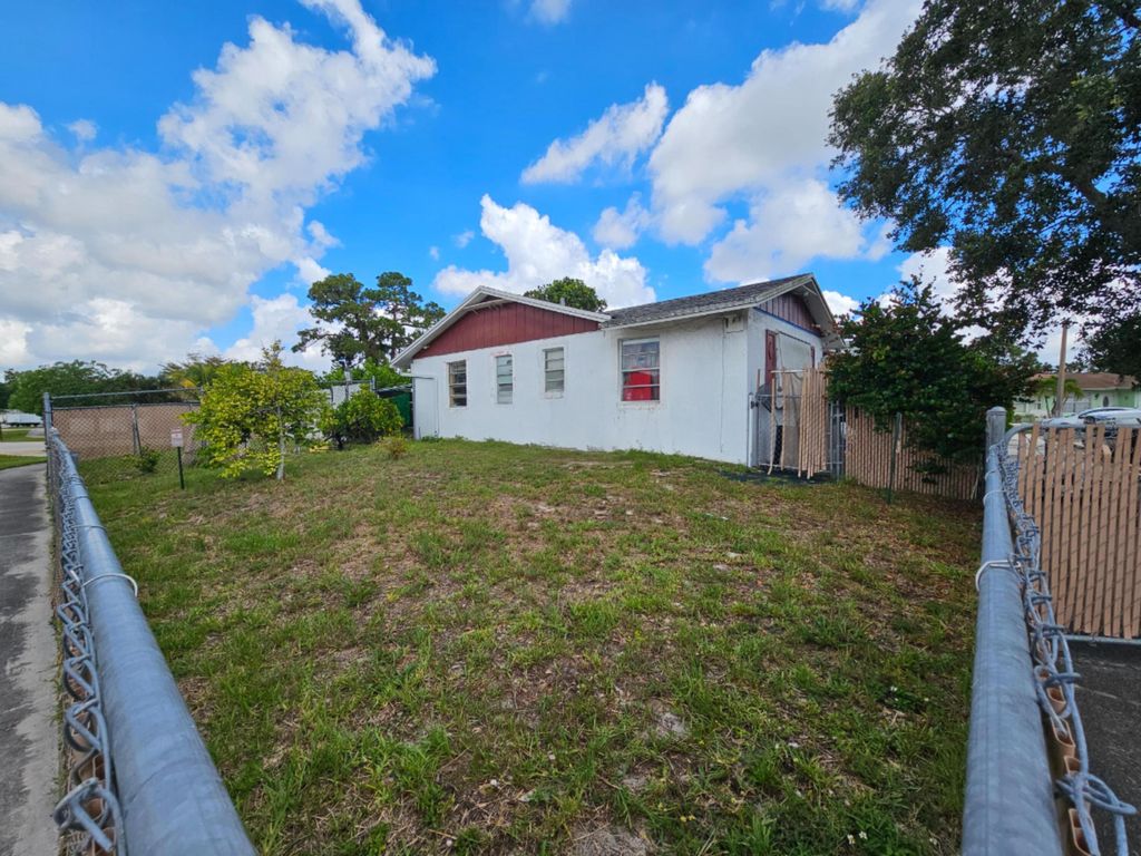 Photo of 773 E Ilene Rd Road E, West Palm Beach, FL 33415 (MLS # B26038501)