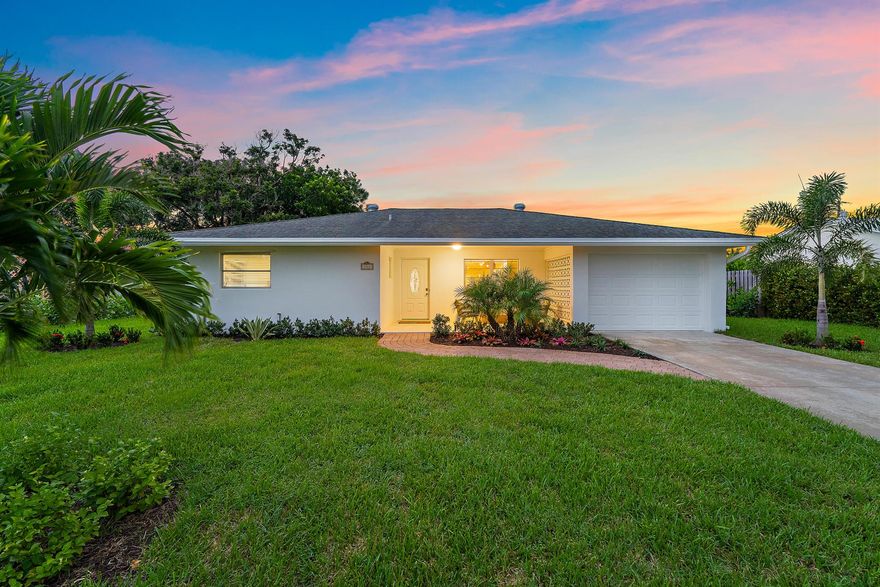 Exquisitely recreated and updated, this single-story Tequesta home blends modern comfort with coastal charm. Just moments from Jupiter Island, the Jupiter Inlet, and Jupiter's pristine beaches, it delivers the best of South Florida living. The reinvented wide-open kitchen is the heart of the home--completely reimagined with white shaker cabinetry, quartz countertops, stainless steel appliances, and an island that seamlessly connects to the dining area and living room. A split floor plan ensures privacy, while plank flooring throughout adds warmth and coastal elegance. Outdoors, enjoy a very large backyard designed for relaxation and entertaining. An open patio invites al fresco dining and evening cocktails under the stars, while the one-car garage provides convenience and storage for