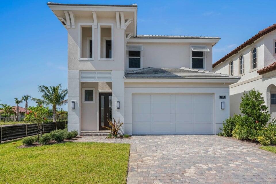 Built in 2021, this stunning contemporary 4-bedroom, 4.5-bath home is a true gem!Located in Palm Beach Gardens within a private gated community, this Drake Island Contemporary model features a first-floor master suite, all impact windows and doors, and a private saltwater pool/spa with smart technology overlooking a serene lake. Inside, the home boasts an open, bright, and spacious floor plan with soaring ceilings. The kitchen is designed for entertaining, complete with an expansive Quartz island, GE stainless steel appliances, and ceiling-height cabinetry. Upstairs, enjoy a large open loft--perfect for an office, gym, or media space--along with three private ensuite bedrooms. The first-floor master suite features an enormous walk-in closet and a luxurious spa-style bath.
