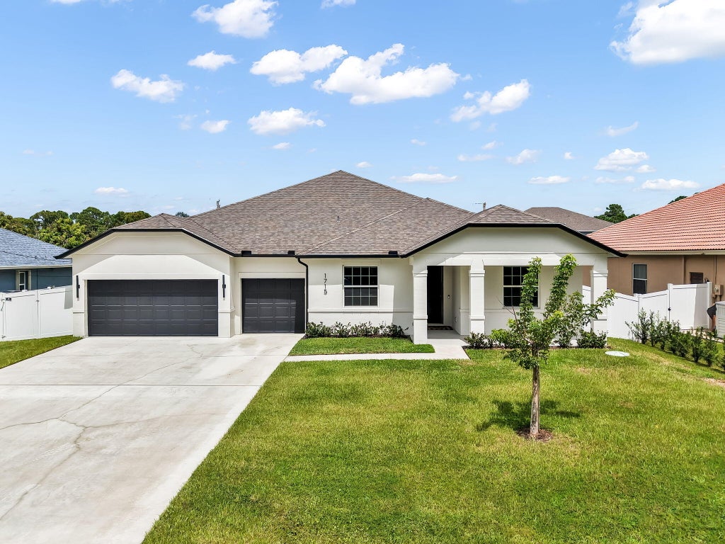 Photo of 1715 SW Apache Avenue, Port Saint Lucie, FL 34953 (MLS # B26076041)