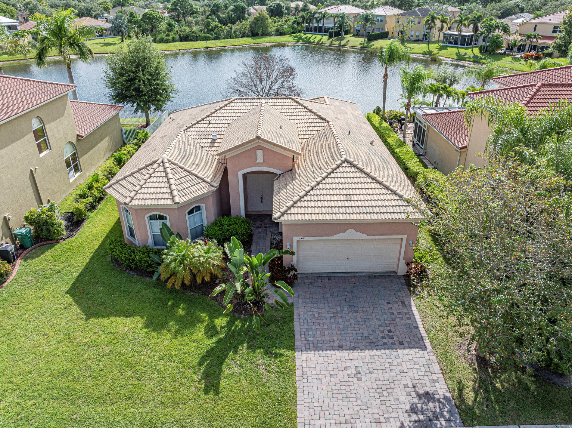 Welcome to this charming 3-bedroom, 2.5 -bath, 2-car garage lakefront home in the prestigious gated community of Portofino Shores. With nearly 2,000 sq. ft. of beautifully designed living space, this residence offers elegance and confort at every turn. Enjoy a bright and spacious floor plan featuring a formal dining room, vaulted ceilings, walk-in closets, and a breathtaking lake view right from your backyard. Portofino Shores is a resort style community offering a gorgeous clubhouse, Olympic-sized pool, fitness center, tennis courts, playground, walking trail, and lush tropical landscaping with sidewalks throughout. Located just minutes from I-95, the Florida Turnpike, and only 15 min. to the beach, this property combines luxury living with convenience. Credit score requirement: 700+.