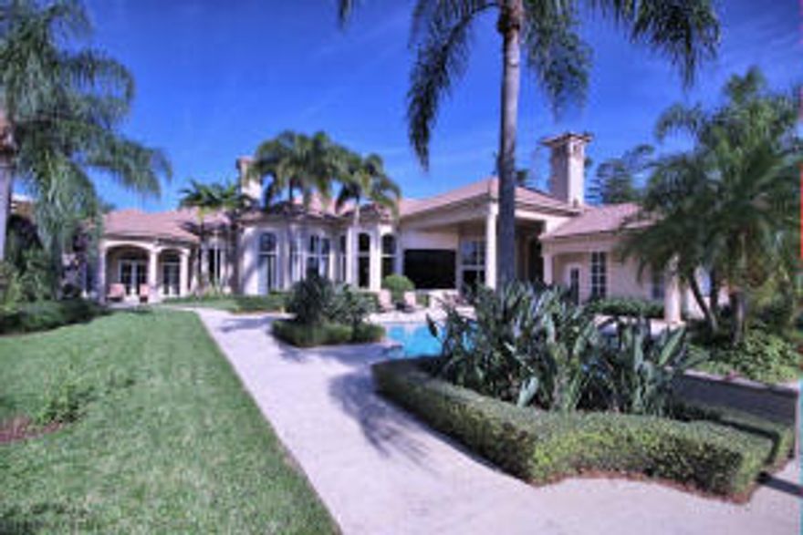 EXQUISITE ADMIRALS COVE WATERFRONT ESTATE WAS CUSTOM BUILT WITH 7290 SQ. FT. UNDER AIR, 3 CAR GARAGE, SITUATED ON AN OVERSIZED LOT AND PROFESSIONALLY DECORATED.  THE RESIDENCE AND GUEST HOUSE OCCUPY 5 BEDROOMS AND 5.5 BATHROOMS. EXQUISITE VOLUME CEILINGS, DESIGNER OFFICE. HAND CARVED WOODWORK THROUGHOUT, NO DETAIL HAS BEEN LEFT OUT.  12 FT FRONT DOOR OPENS TO A GRAND FOYER WHICH SETS THE TONE FOR THE ONE OF A KIND ESTATE.