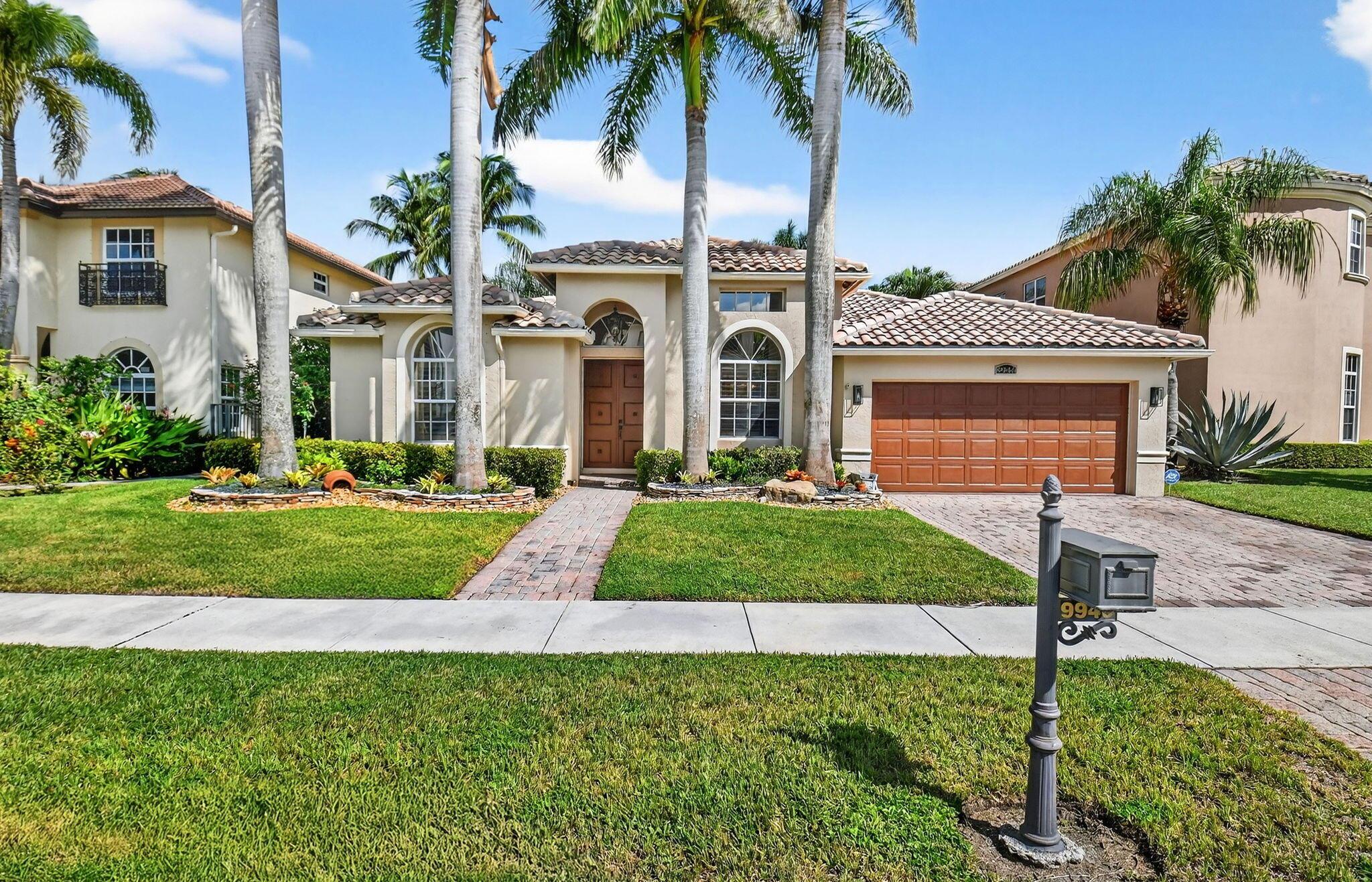 This stunning 4-bedroom residence showcases sweeping lake views, soaring coffered ceilings, plantation shutters, and timeless architectural details. The gourmet kitchen offers abundant custom cabinetry, stainless appliances, and a quartz waterfall breakfast bar. A luxurious primary suite provides two custom closets, a spacious sitting area, and spa-inspired bath. French doors open to a serene, screened patio, perfect for entertaining or quiet relaxation.Upgrades include new AC, whole-house generator, professional landscaping, and paver hardscape. Coronado Estates offers gated entry, clubhouse with fitness, tennis, basketball, playground, and social spaces--all in a prime location near top schools, shopping, and within walking distance to houses of worship.