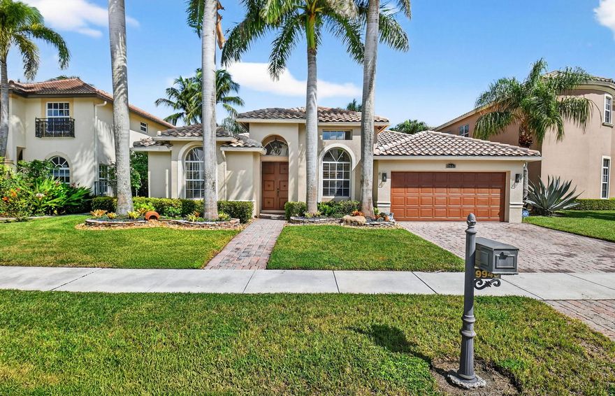 This stunning 4-bedroom residence showcases sweeping lake views, soaring coffered ceilings, plantation shutters, and timeless architectural details. The gourmet kitchen offers abundant custom cabinetry, stainless appliances, and a quartz waterfall breakfast bar. A luxurious primary suite provides two custom closets, a spacious sitting area, and spa-inspired bath. French doors open to a serene, screened patio, perfect for entertaining or quiet relaxation.
Upgrades include new AC, whole-house generator, professional landscaping, and paver hardscape. Coronado Estates offers gated entry, clubhouse with fitness, tennis, basketball, playground, and social spaces—all in a prime location near top schools, shopping, and within walking distance to houses of worship.