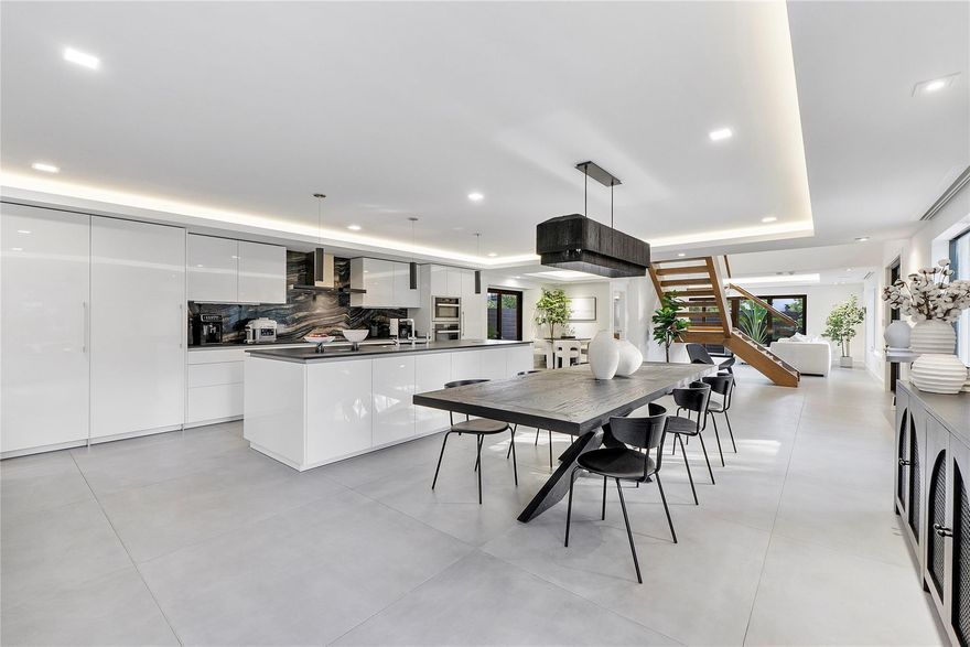 A truly unique modern home in the heart of Victoria Park, this 5-bedroom, 4.5-bath residence blends sleek design with advanced smart-home technology. Just blocks from Las Olas & Holiday Park, it includes a private 1 bedroom, 1 bathroom apartment with its own entrance - perfect for guests, rental income, or office. The outdoor oasis features a heated saltwater pool, Wolf summer kitchen, custom pergola with gym area, & contemporary landscaping. Inside, a Poggenpohl kitchen with Miele, Wolf, Sub-Zero, & Duravit appliances flows seamlessly into living areas highlighted by a floating glass staircase, custom bar, & air-conditioned 2 car garage. Complete with a whole-house generator, Culligan water system, & Crestron/Sonos automation, this home is truly one of kind!