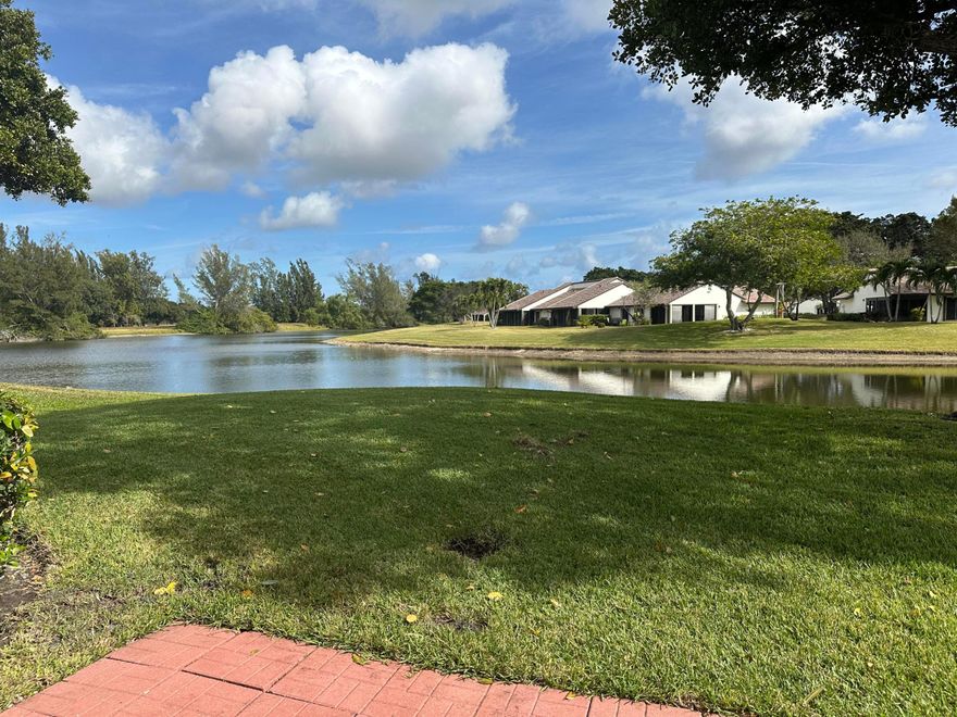 New Roof! Lake view!  This is a 2 story building the new HOA rules do not apply.Motivated seller! Can close quickly! Great First-floor unit with a beautiful lake view, lots of lakes and green space and sidewalks for walking! There is no mandatory country club membership required in this section!  HOA fee includes Xfinity triple play, high speed internet, land line, tons of channels, water, lawn maintenance, painting, roofs, pest control, dryer vent cleaning, three pools and an active clubhouse Tile throughout. Eat-in kitchen, Separate dining area, remodeled primary shower, brand new closet doors. Lanai has windows and screens and accordion shutters. Air Conditioning: Unit is 6 years old. One person 55 and other can be 19 years old One pet allowed 20 lb. limit