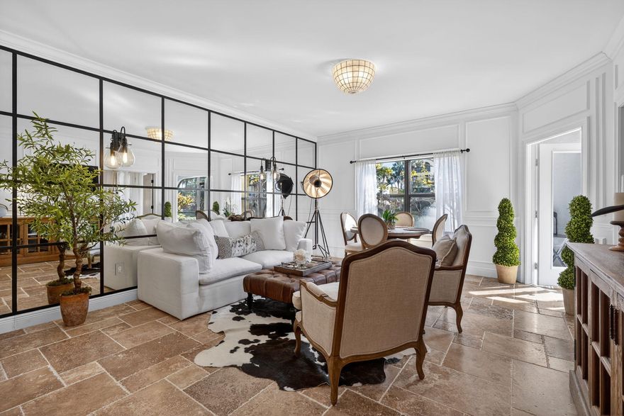 NEWLY PRICED UNFURNISHED! Stunning renovation of this 1BR/1BA first-floor unit. Beautifully designer-inspired space thoughtfully curated featuring European tumbled Versailles travertine flooring throughout, extensive millwork, nickel fixtures, and a dramatic mirrored wall, making this condo truly one of a kind. Enjoy a fully equipped chef's kitchen with stainless steel Viking appliances, and Caesarstone countertops. The bathroom offers a private guest-side entry, porcelain tile, and marble-top vanities. With serene lake views and the soothing sounds of the fountain, the space feels like your own private spa retreat. This spacious unit has loads of natural light, breezy screened in porch, washer/dryer in unit, open kitchen & bike storage for 2 bikes.
(*Available fully furnished for 499K) The condo is offered unfurnished, however everything is available for purchase separately and is negotiable: RH designer furnishings including Cloud Sofa; Turkish towels and Italian linen bedsheets.  The unit is available completely turnkey with everything from an air fryer to Nespresso machine. The fully equipped chef's kitchen has KitchenAid mixer, Vita-mix, and UV water filtration. 
 
Ocean Trace is a gated community offering two pools, a clubhouse, and a gym. Enjoy the serene lake with its fountain and a gazebo that cantilevers over the water. Conveniently located just minutes from beach access in Juno Beach and close to world-class shopping and dining.