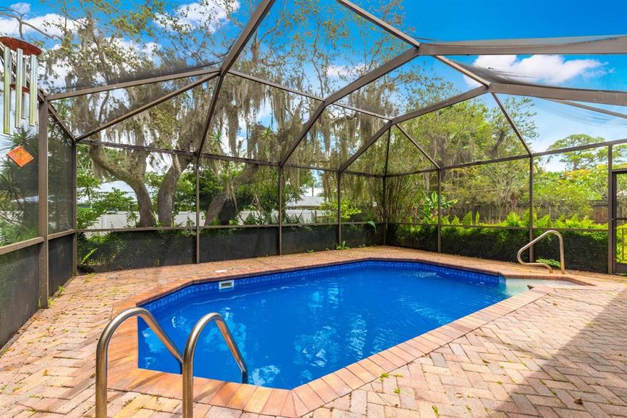 Home, nestled on a private, wooded lot. 2 Driveways for Boat & Rv parking. Boat Ramp available in optional HOA Updated Kitchen with Gas stove. Tongue & groove ceilings in the living area. Brand new pool heater. Game room! Open floor plan. Quiet street with a county feels yet easy access to I-95 and stores.