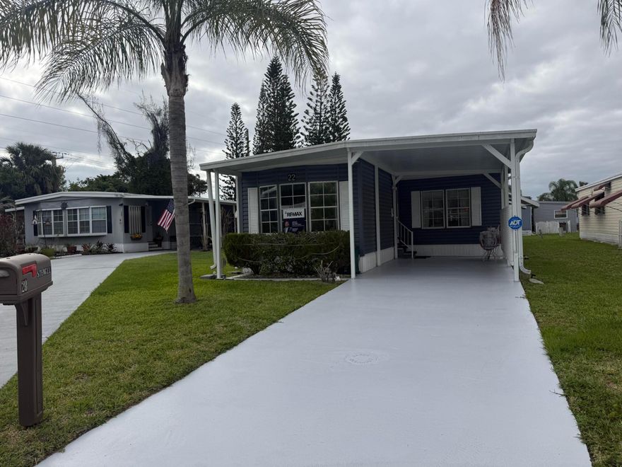 Land Lease Home - $833.06 
Welcome to this beautifully maintained 2-bedroom, 2-bathroom home located in the desirable 55+ community of Spanish Lakes. This move-in ready residence features a 2018 A/C, sealed roof (May 2025), and a new water heater (February 2025). All windows have shutters, and the home is equipped with gutters, and an ADT security system for added peace of mind. Enjoy vinyl flooring in the living and dining areas (installed 2020) and cozy carpet in both bedrooms. Washer (2023) and dryer (2022) are included. Experience comfortable and worry-free living in this wonderful active adult community with resort-style amenities.