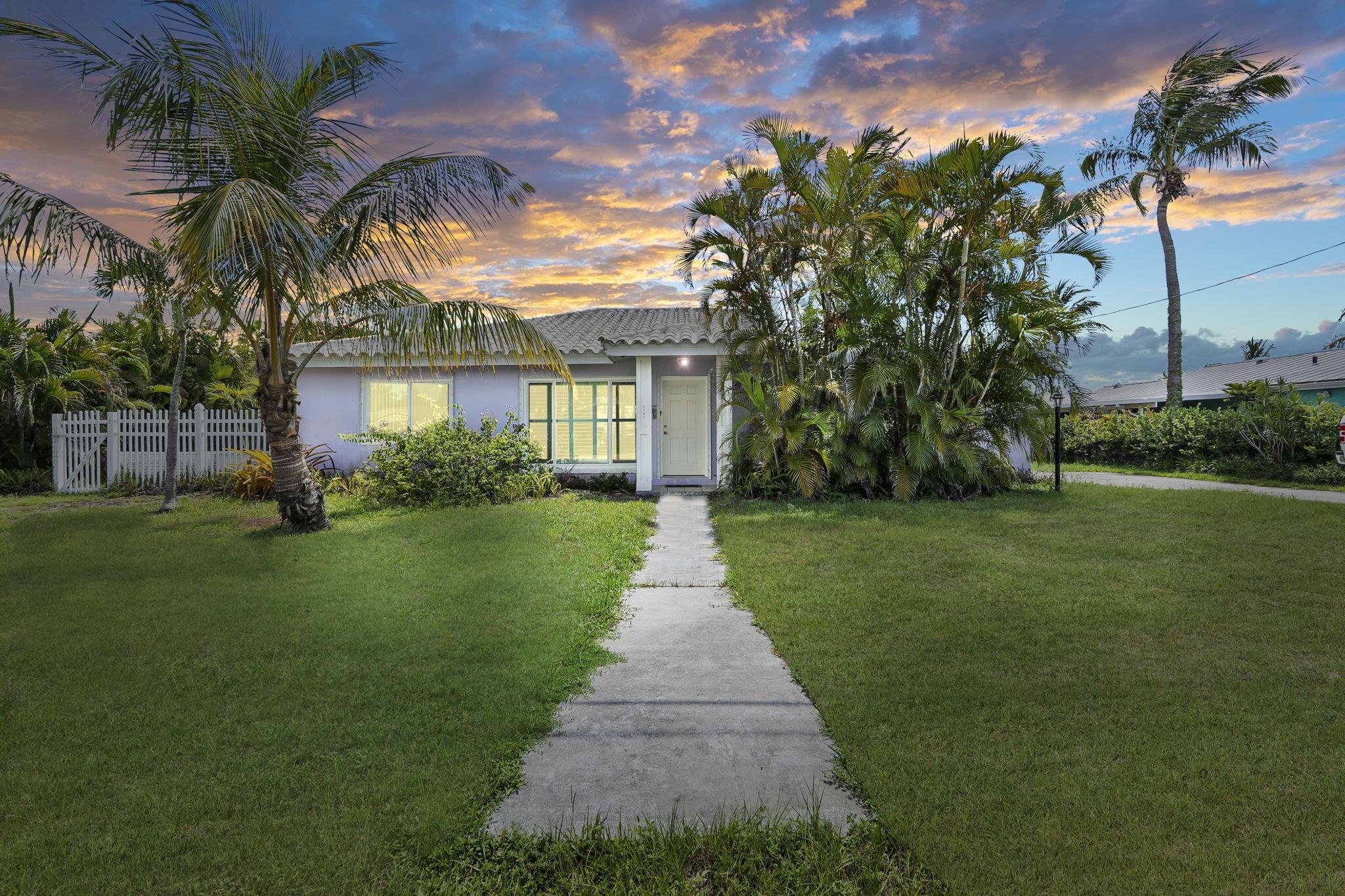 This island 3 bedroom 2 bath 1 car garage beach home is freshly painted and full of Florida charm. Surrounded by lush greenery it is ready for your own personal updates. A spacious living and elevated dining room opens up onto the large backyard patio. Vintage bathrooms enhance the Florida charm. The fenced yard is complete with utility storage. Come and enjoy island life on our pristine Hutchinson Island - the BEST for sun and sandy beaches. Entertaining and enjoying tranquility in your new home located just two blocks from the South Jetty Inlet Park, public beaches and coastal fishing makes this the perfect location. Travel the island by golf cart to visit restaurants, shops and museums. Island life awaits! Make it yours today! Listed at actual appraised value.