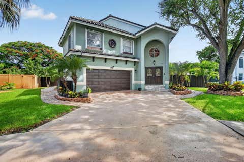 Photo of 5901 NW 58th Terrace, Parkland, FL 33067 (MLS # B26050298)
