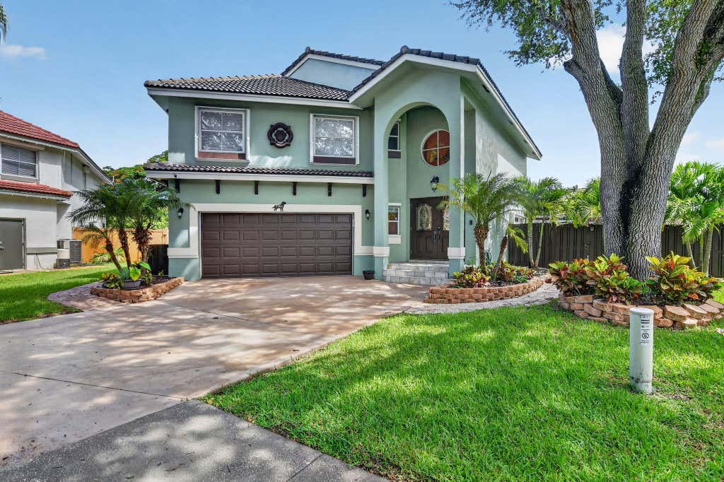 Photo of 5901 NW 58th Terrace, Parkland, FL 33067 (MLS # B26050298)