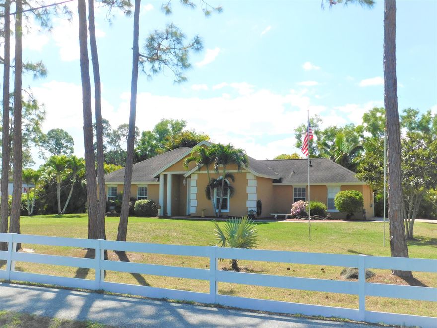 Perfect Family Home ! This 4 bedroom 2 bath home is nestled on its own natural acre. Come see this immaculate home and all it has to offer. The kitchen features granite counters, breakfast bar, stainless steel appliances, large pantry and an under mount sink. The Master boasts a Tray Ceiling, all tile floors and a walk in closet. The additional 3 bedrooms are also all tiled and are on the other side of the house.Relax outside on your covered back porch or take a dip in the above ground pool with deck area. Long driveway for parking. The yard is fenced and fully sodded. Beautiful shrubs and plants.Great location on a paved road and close to town. Lots of room for kids to play, horses or pets. No HOA dues to pay. RV's and boats are welcome too.