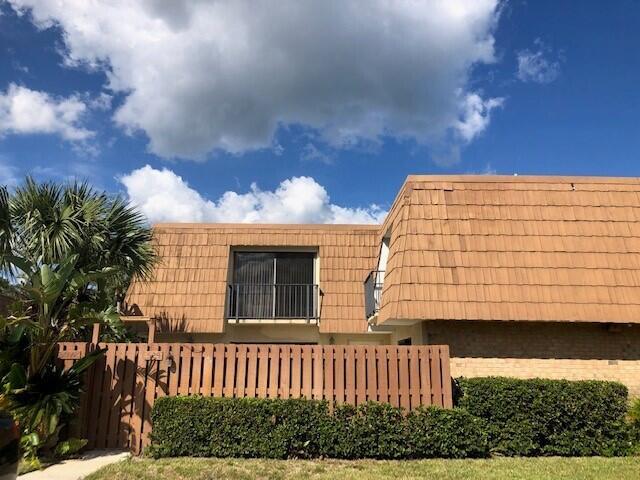 River Pines is a townhome community located in South Stuart, positioned where Cove Road ends at the Atlantic Intracoastal Waterway. It overlooks Jupiter Island and is adjacent to Miles Grant Country Club. To the south, River Pines is bordered by Sea Branch Preserve, a state-owned property. This well-maintained unit features 2 bedrooms and 2 bathrooms, with tile flooring on the lower level and carpet in the bedrooms. The kitchen is equipped with stainless steel appliances and granite countertops. Additionally, it includes a privacy-fenced outdoor patio area. The Association offers a range of amenities, including tennis courts, pickleball courts, handball courts, a walking trail, two swimming pools, licensed watercraft storage, and a boardwalk that meanders through two ecosystems along