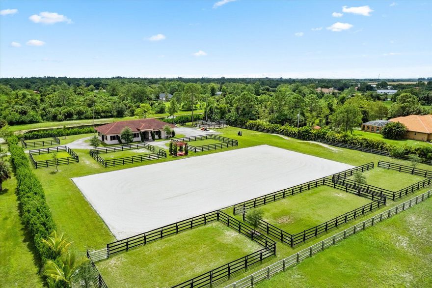 Private world class equestrian facility for annual or seasonal rental! This stunning 8 stall hurricane safe CBS barn built in 2020 with high end finishes includes two wash or grooming stalls, tack room, feed room with roll down door, half bath, and riders lounge complete with refrigerator and a washer and dryer. The property features seven paddocks, MK horse walker, hills for training, an irrigated 100 X 200 riding arena, and an RV hookup. Horse area is fully fenced with its own separate entrance and circular driveway which makes it easy to navigate for large rigs or feed trucks. Located in the gated community of Deer Run, hacking distance to White Fences, surrounded by miles of riding trails, and within minutes of all Wellington horse show venues.