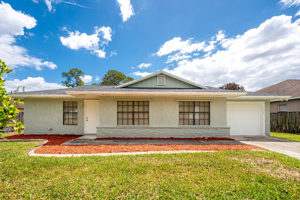 Photo of 1781 SW Cloverleaf Street, Port Saint Lucie, FL 34953 (MLS # B26019350)