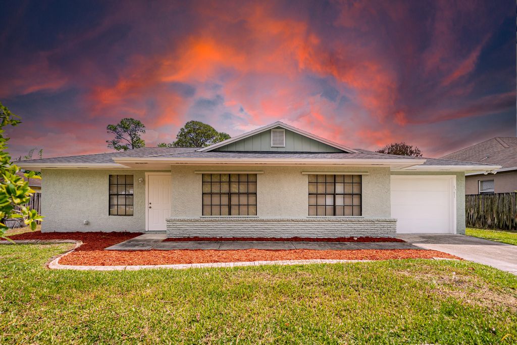 Photo of 1781 SW Cloverleaf Street, Port Saint Lucie, FL 34953 (MLS # B26019350)